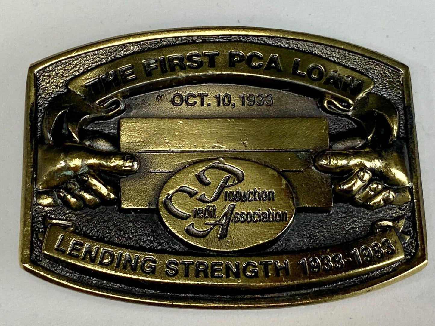 The First PCA loan Production Credit Assn. The Great American Belt Buckle Co