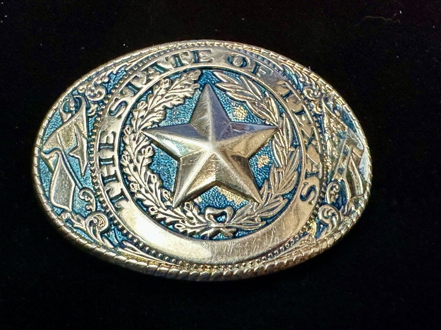 The Great State of Texas - gold color star belt buckle with blue colored accents