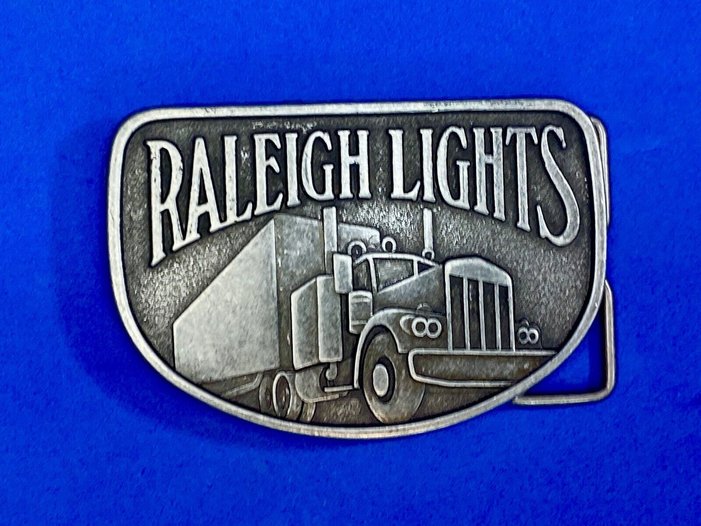 Vintage Belt Buckle Raleigh Lights Cigarette Trucker Trucking Cigarettes