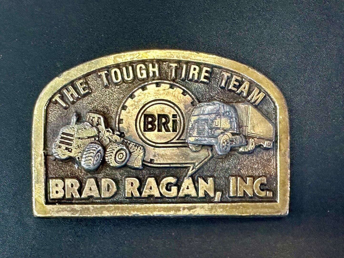 The Tough Tire Team BRi Brad Ragan, Inc. vintage belt buckle by Spec-Cast