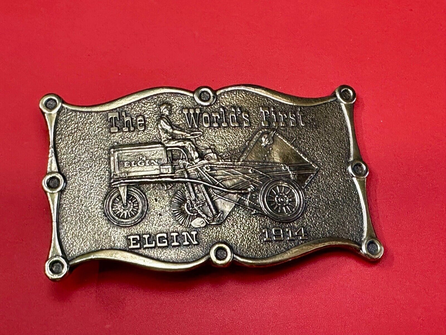 The Elgin, The worlds first tree sweeper commemorative belt buckle by Lewis