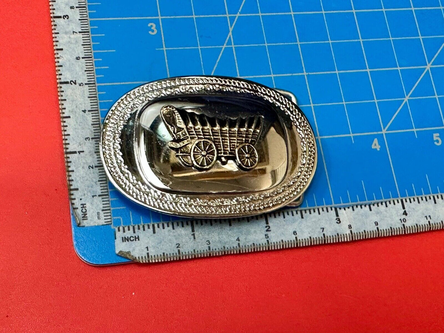Vintage Covered Wagon on reflective oval two tone western belt buckle