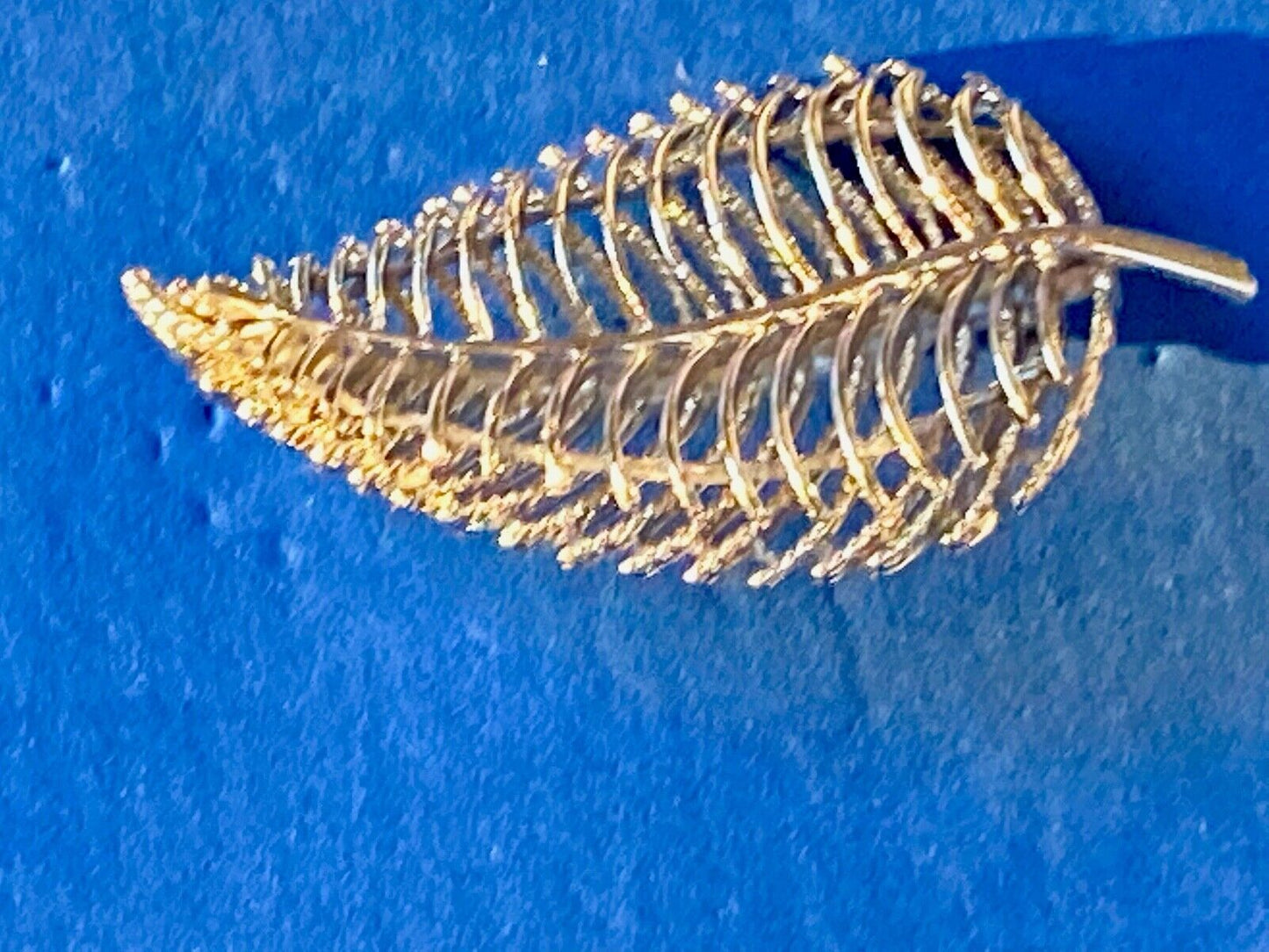 SWP INC signed Gold tone skeleton see through leaf brooch