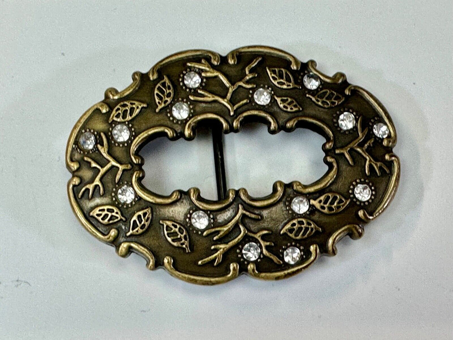 3" wide brown rhinestone accented leaf pattern semi oval belt buckle