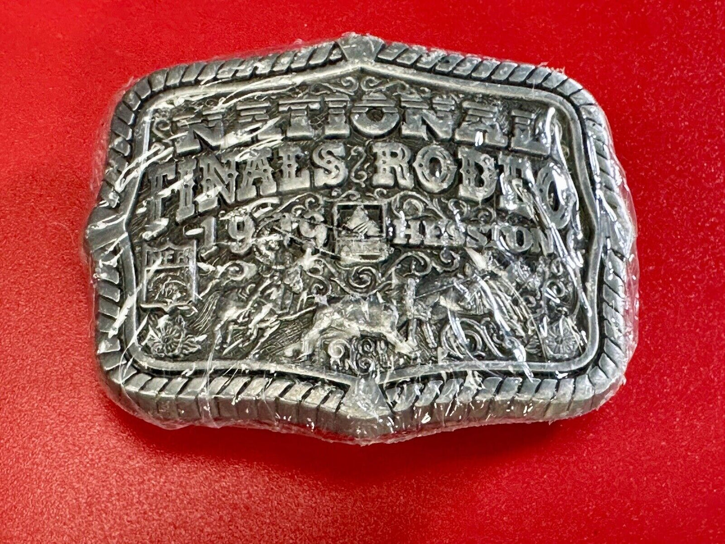1999 Youth Sized Hesston National Finals Rodeo 2000 series belt buckle in wrap