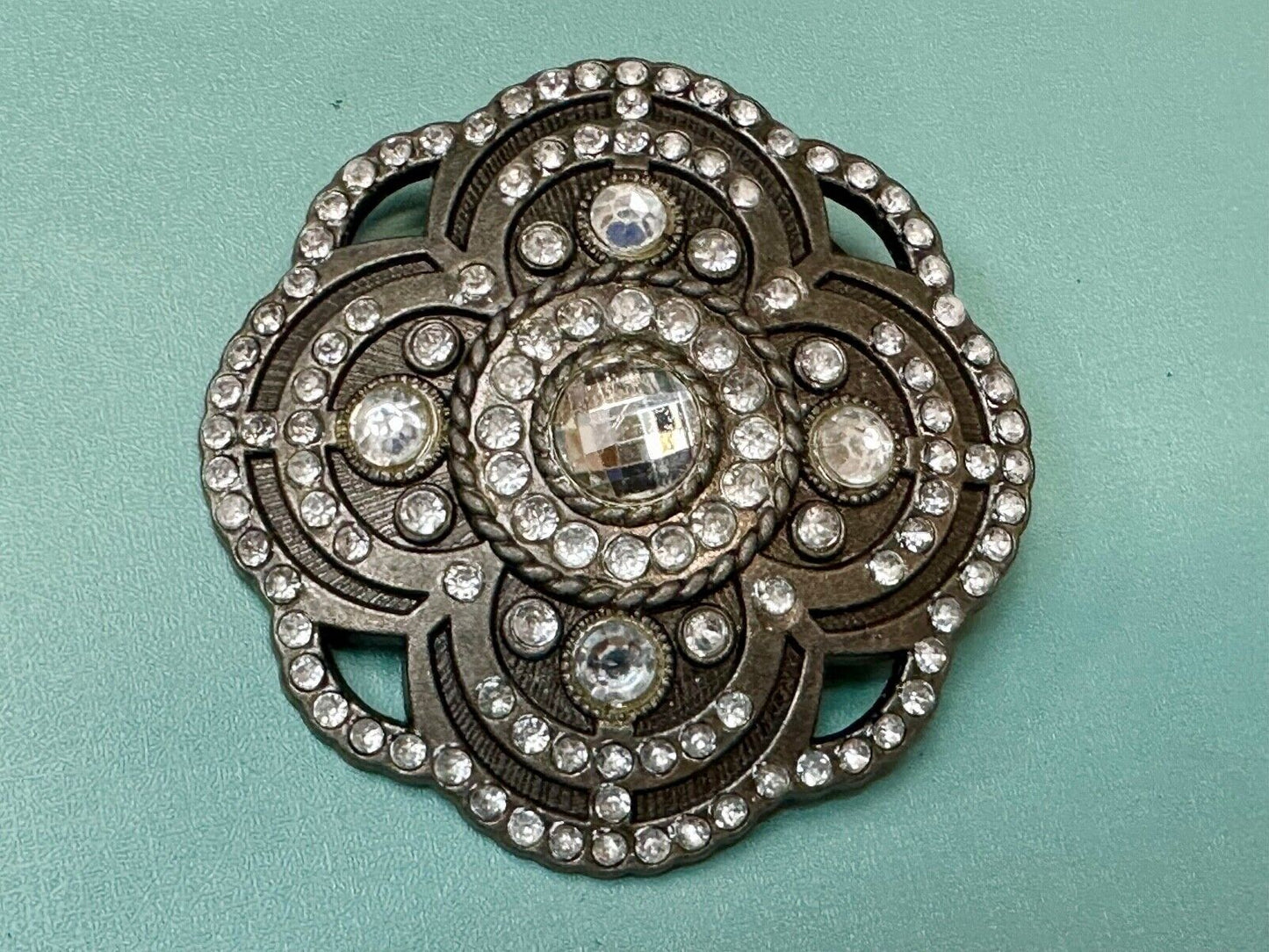 Beautiful Rhinestone accented see through flower shaped cutout belt buckle
