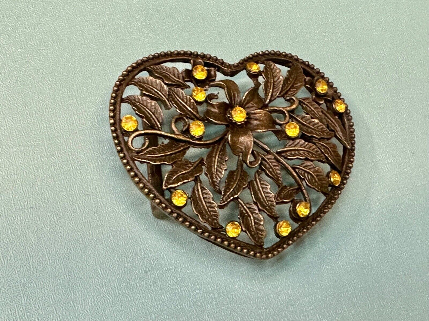 Beautiful see through Heart shaped belt buckle with yellow rhinestone accents