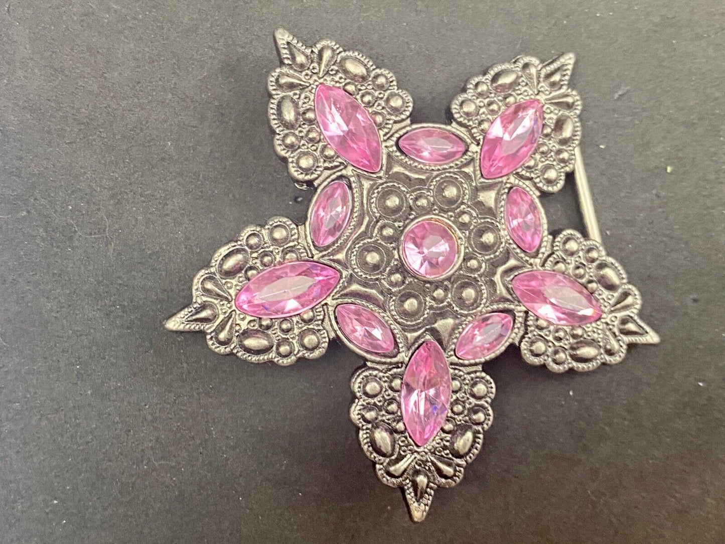 Beautiful figural star with pink accent rhinestones
