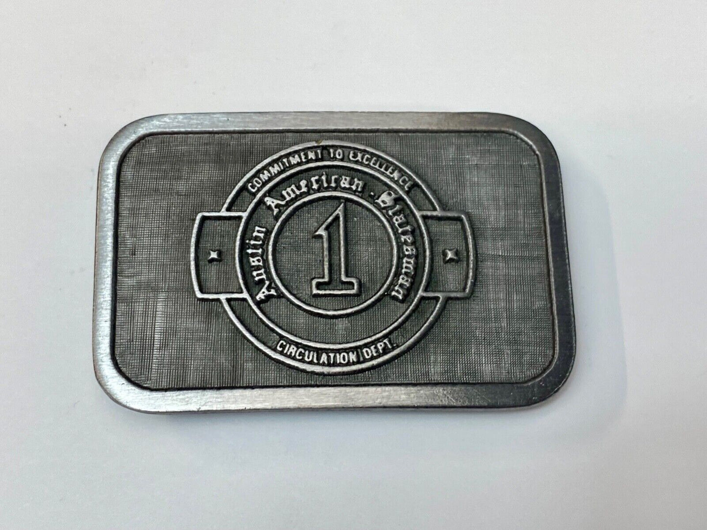 Asian American Circulation Dept Commitment to excellence belt buckle hit-line