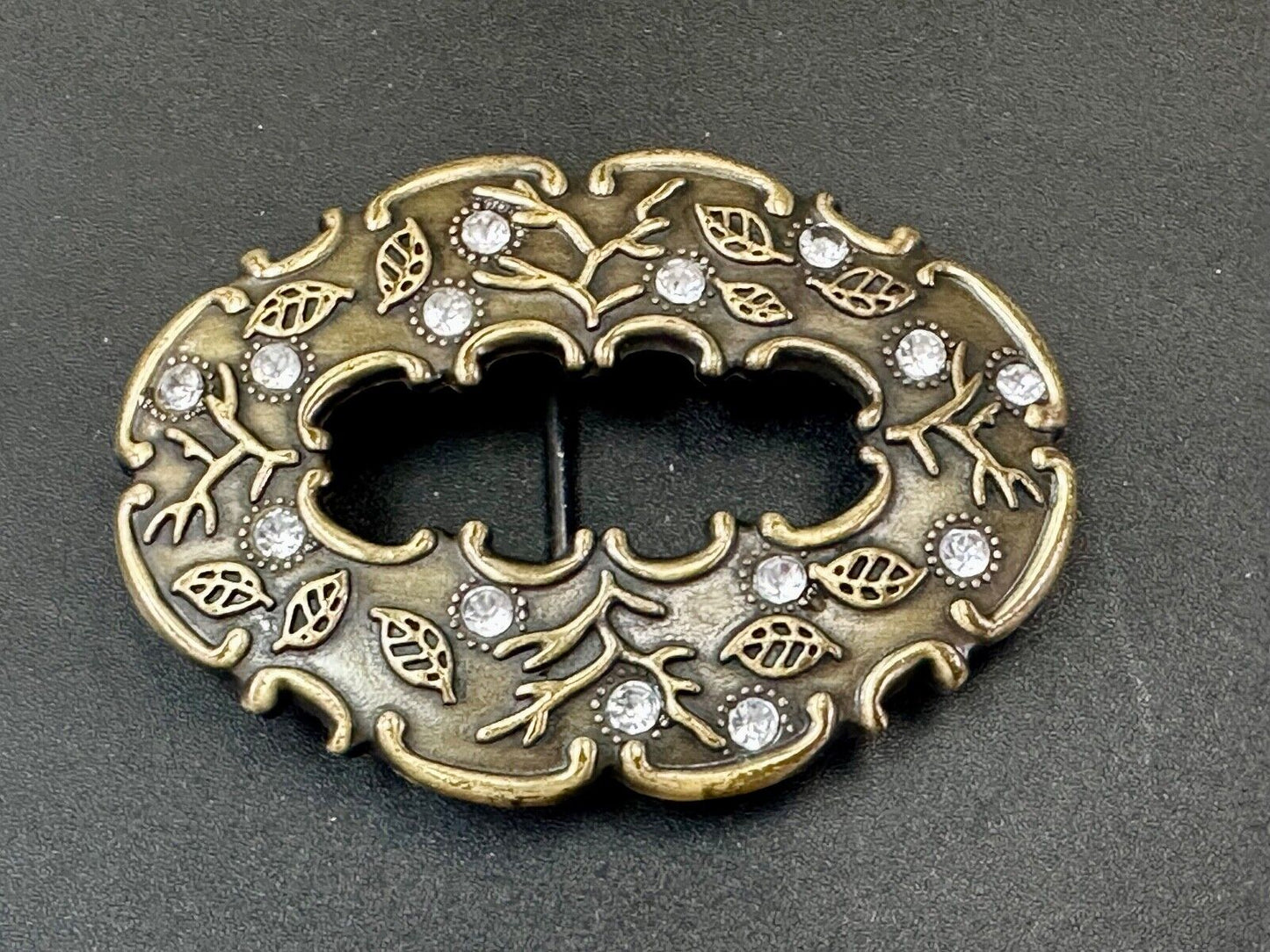 3" wide brown rhinestone accented leaf pattern semi oval belt buckle