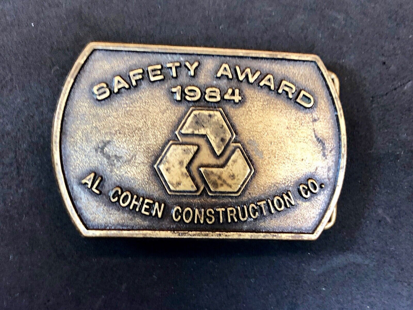 Vintage 1984 AL Cohen Construction Company promotional belt buckle safety award