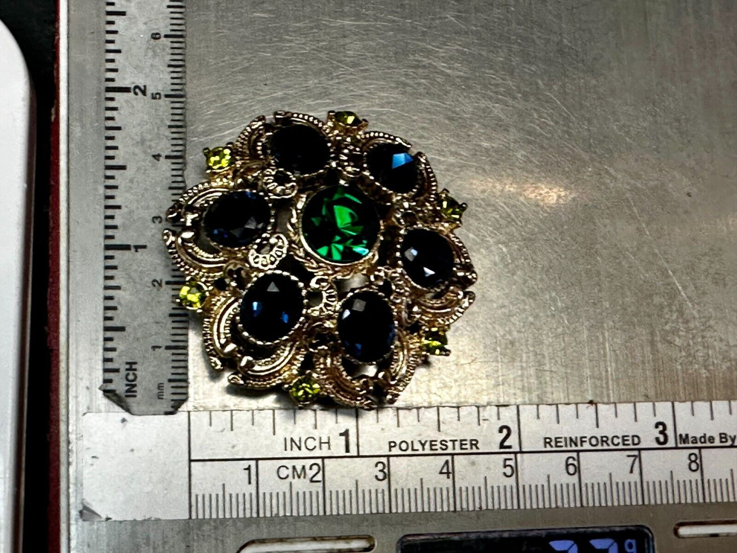 Beautiful Round Flower Shaped Blue Green Rhinestone Brooch Pin Signed by SQUIRE