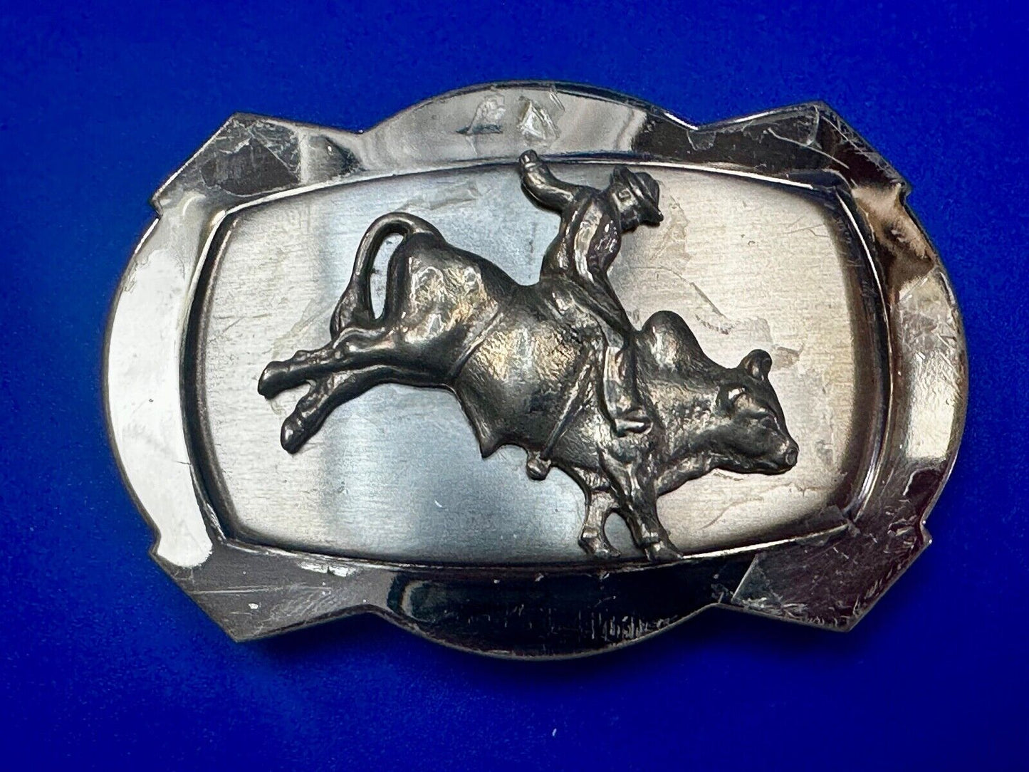 Vintage Cowboy Saddle Bronc on reflective two tone western belt buckle