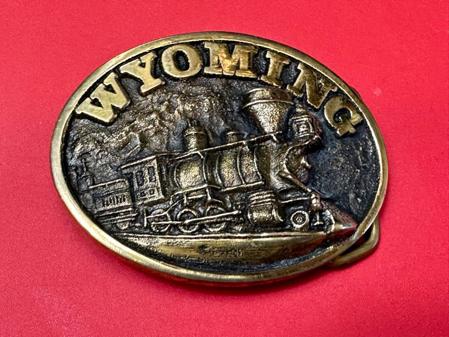 The great state of Wyoming Train History brass belt buckle by Heritage Mint LTD