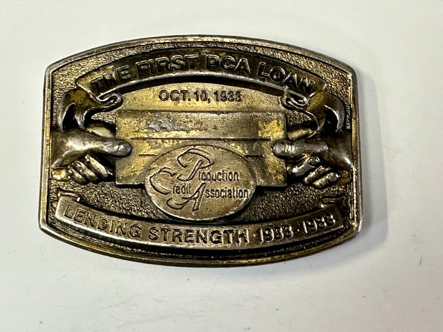 The First PCA loan Production Credit - Vintage The Great American Belt Buckle Co