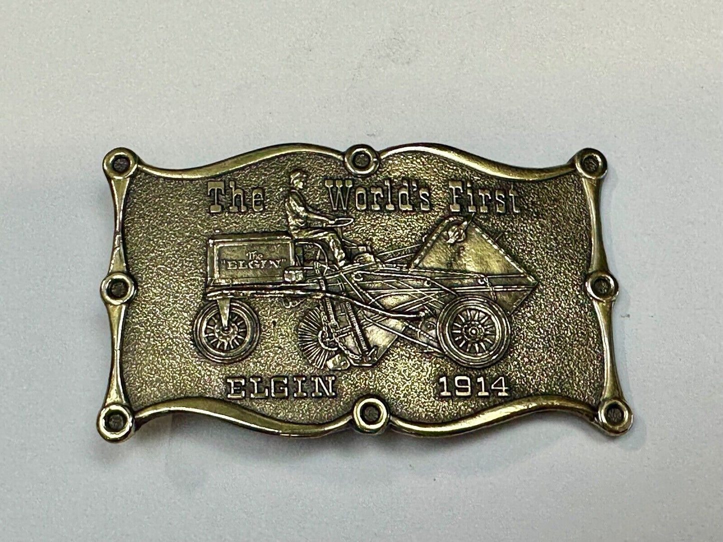 The Elgin, The worlds first tree sweeper commemorative belt buckle by Lewis