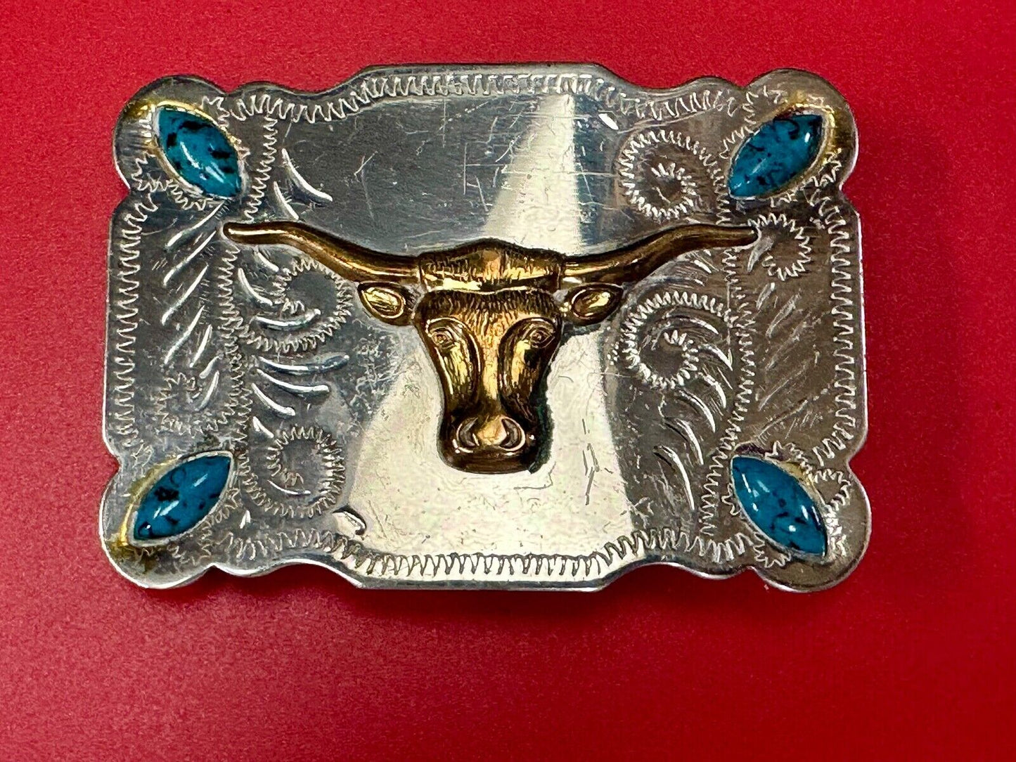 The Longhorn cow steer western nickel silver belt buckle with turquoise accents