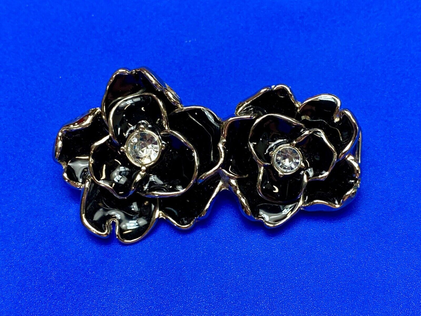 Beautiful two figural flowers with jewels as black & silver colored belt buckle