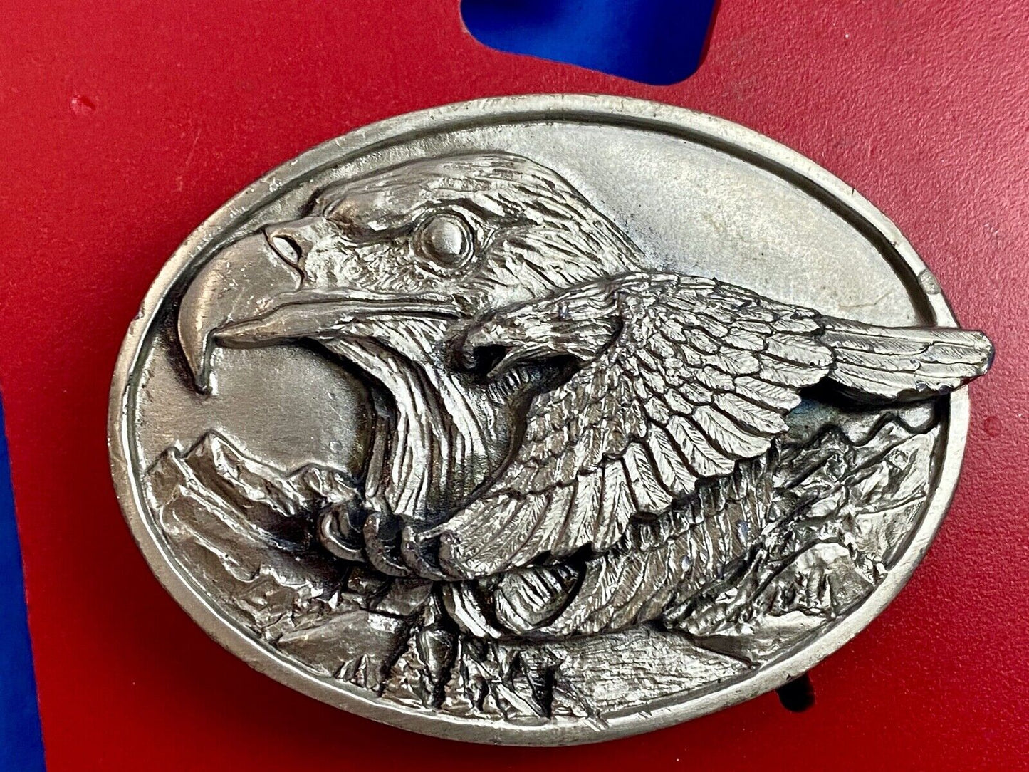 big cabin eagle head bust over mountains nature belt buckle on card