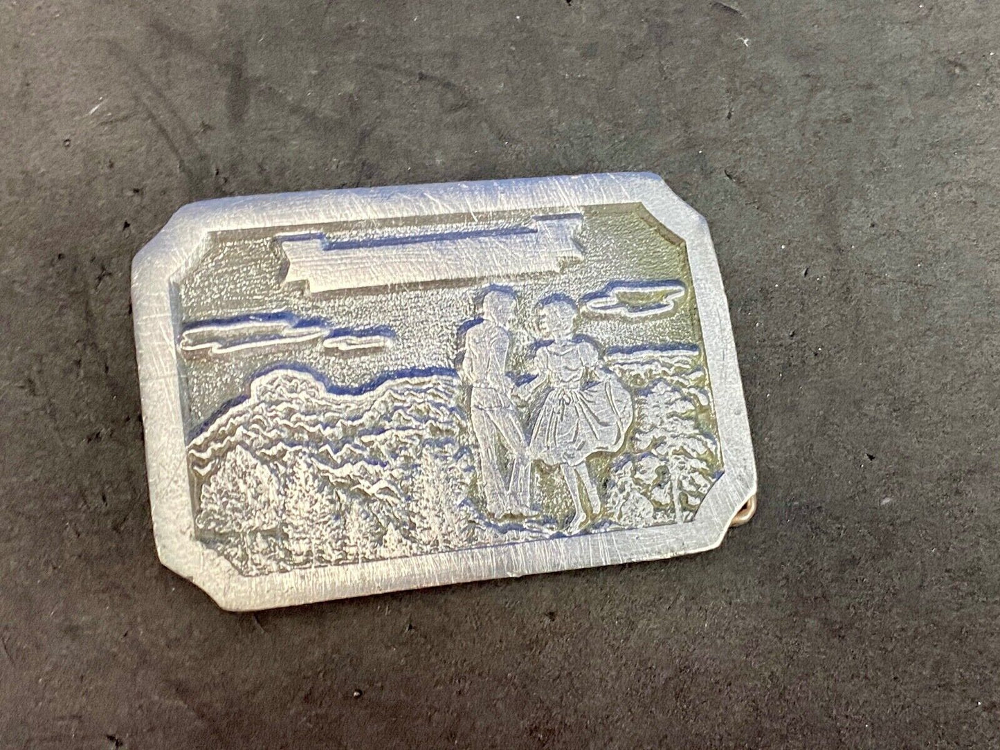 Vintage daleco belt buckle featuring a dancing couple