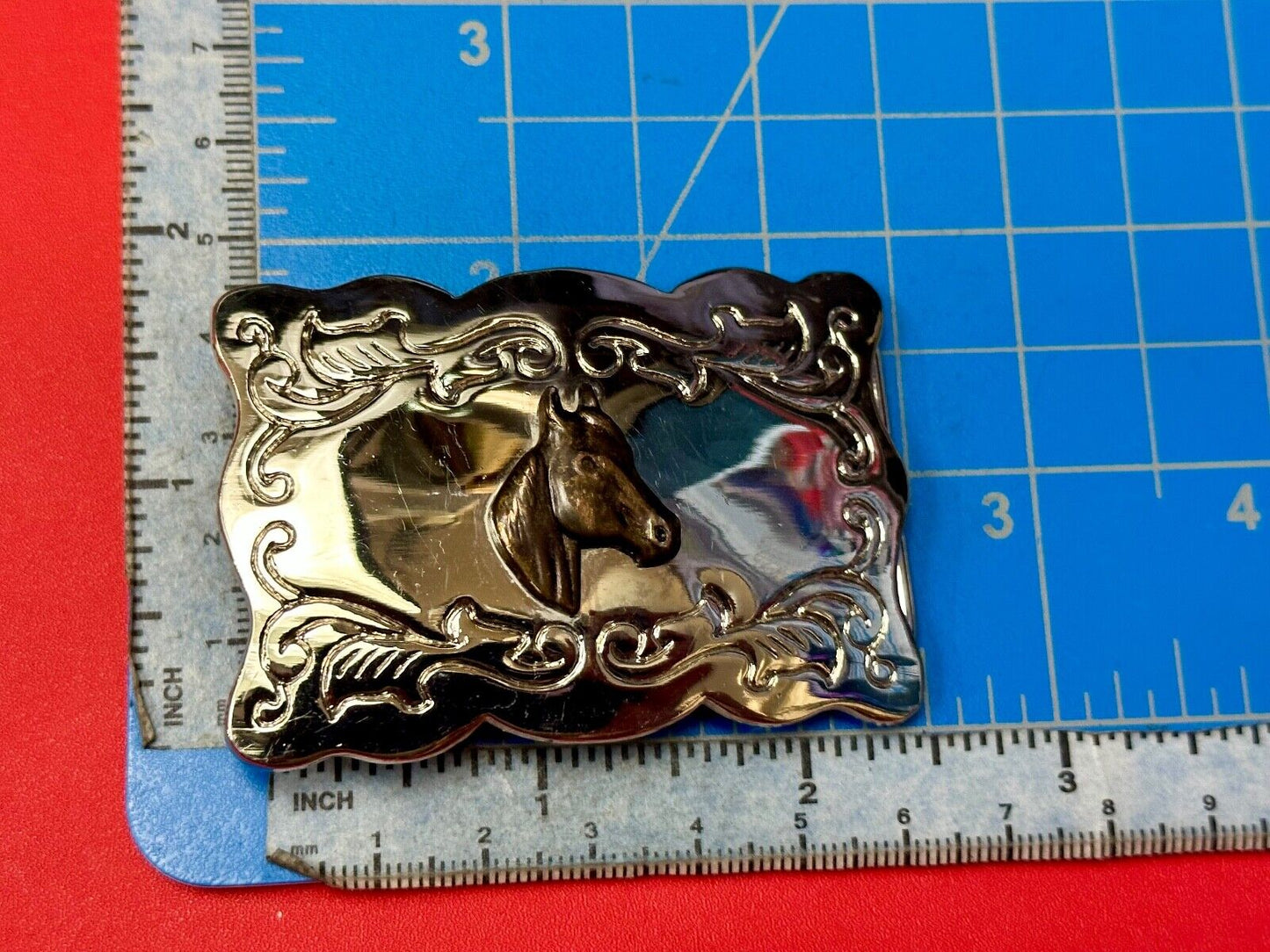 Vintage horse head centered on western rectangular two tone belt buckle