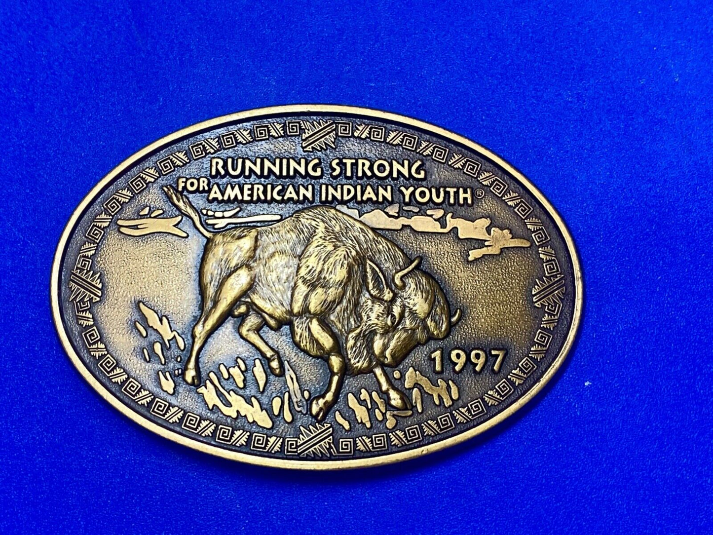 Vintage 1997 BUFFALO belt buckle RUNNING STRONG FOR AMERICAN INDIAN YOUTH