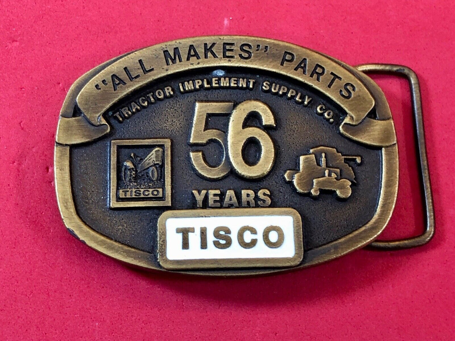 TISCO - 56 years tractor farming parts supply store advertising belt buckle