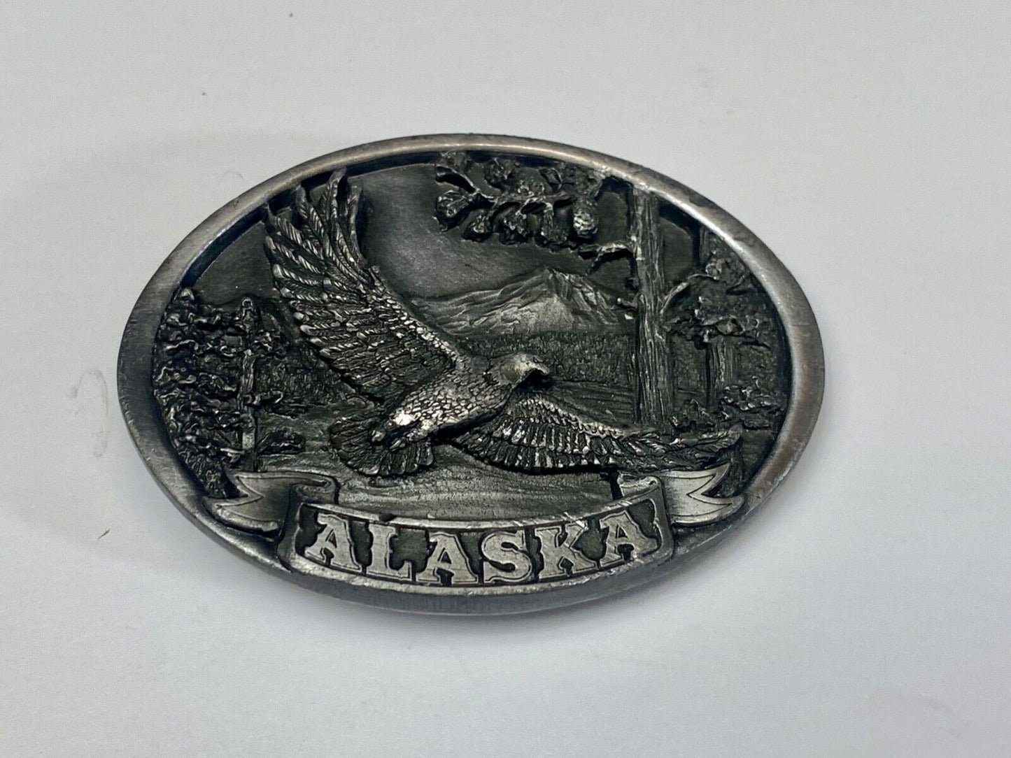 Vintage 1986 Eagle flying high over mountains Alaska belt buckle by C+-J