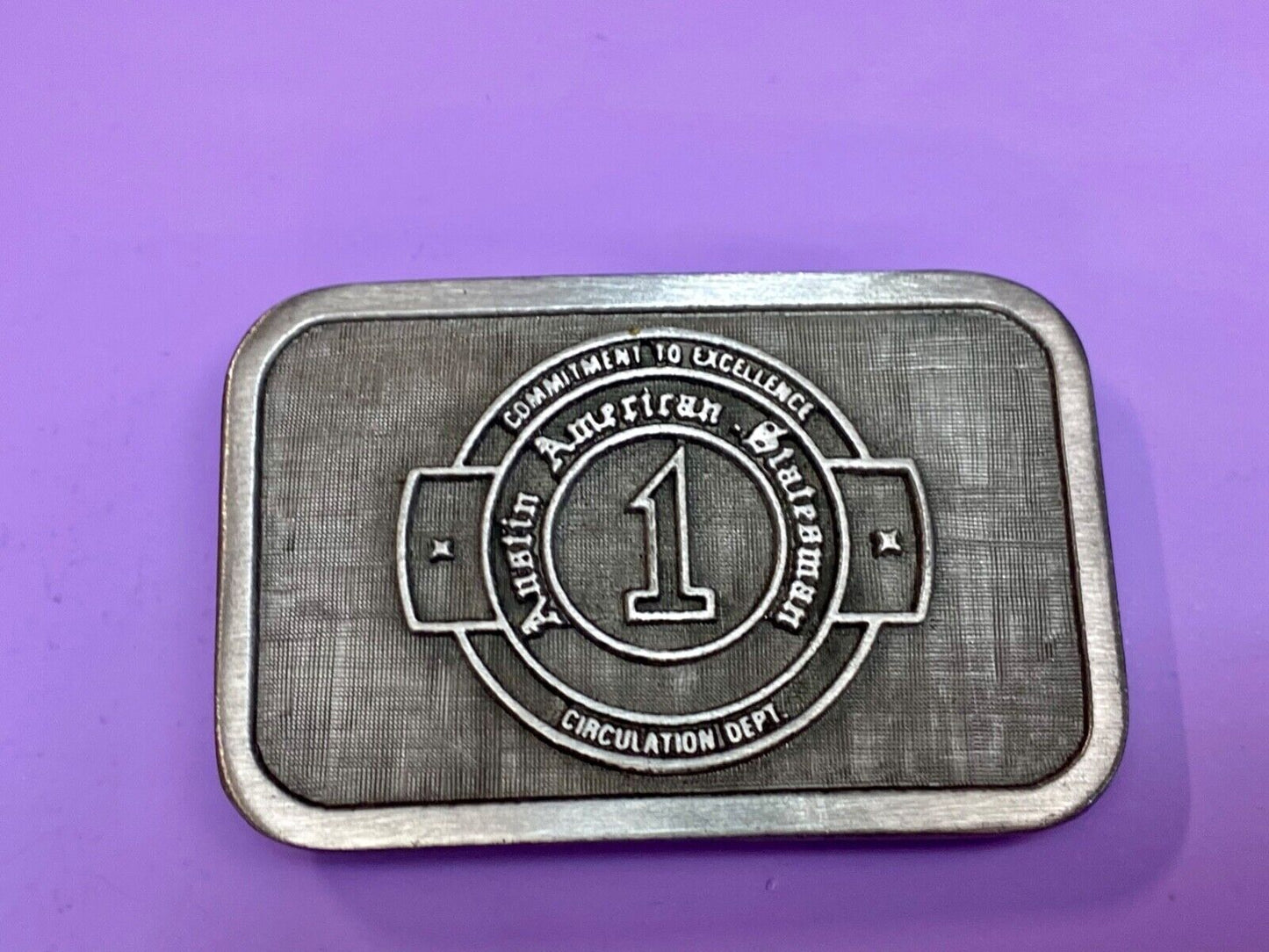 Asian American Circulation Dept Commitment to excellence belt buckle hit-line