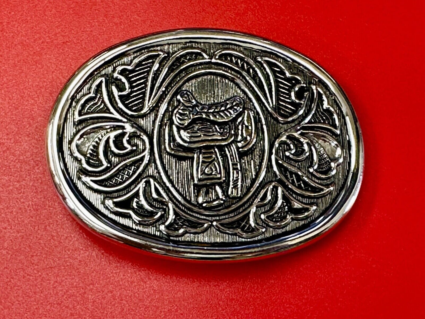 Vintage Cowboy's Horse Saddle ornate flower swirl oval belt buckle by Avon