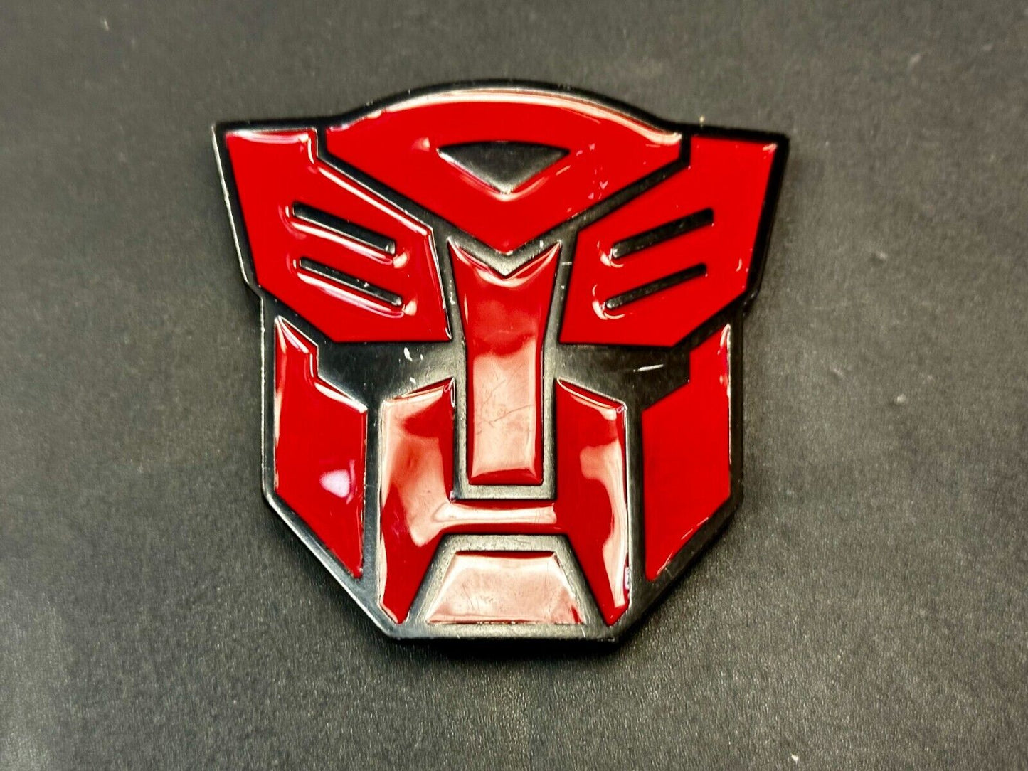The Transformers Autobot More Than Meet The Eyes Symbol Red Cutout Belt Buckle
