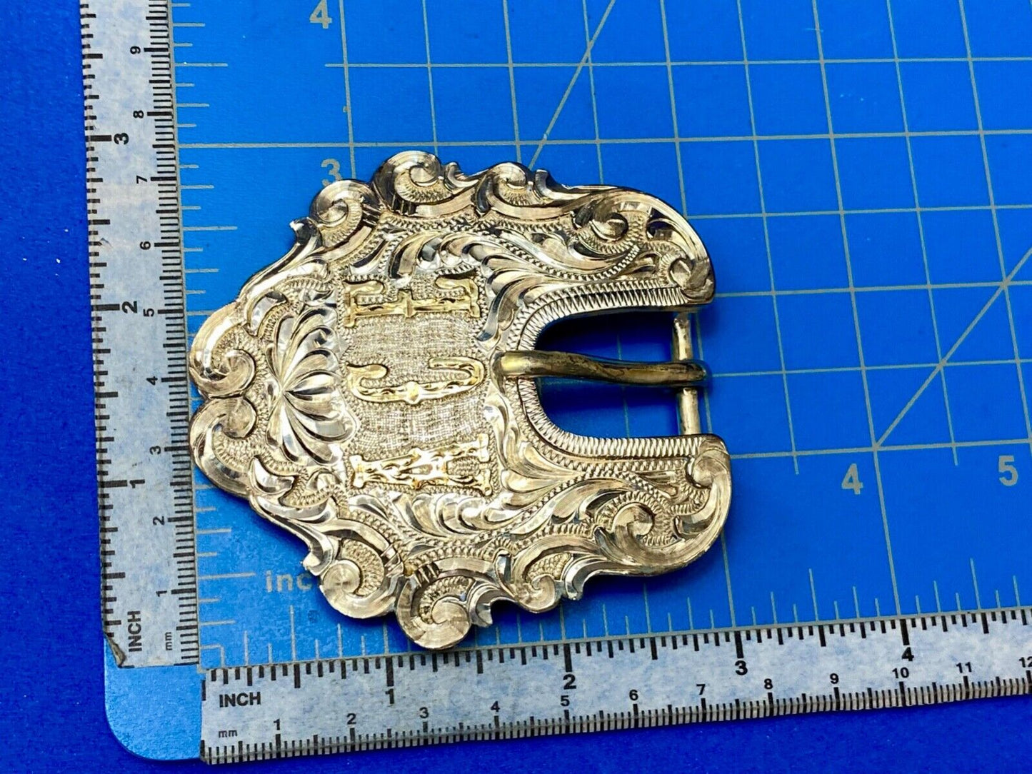 Vintage ACE Western cowboys flower swirl belt buckle design by DALE Chavez