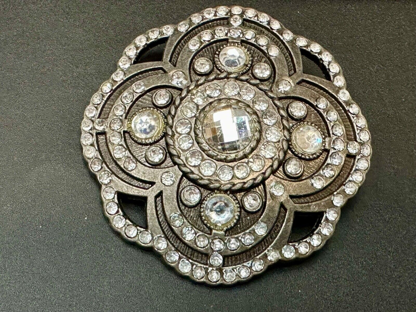 Beautiful Rhinestone accented see through flower shaped cutout belt buckle