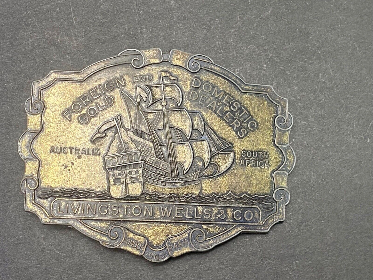 VINTAGE ANTIQUE METAL BELT BUCKLE- Livingston Wells & Co Sailboat Ship
