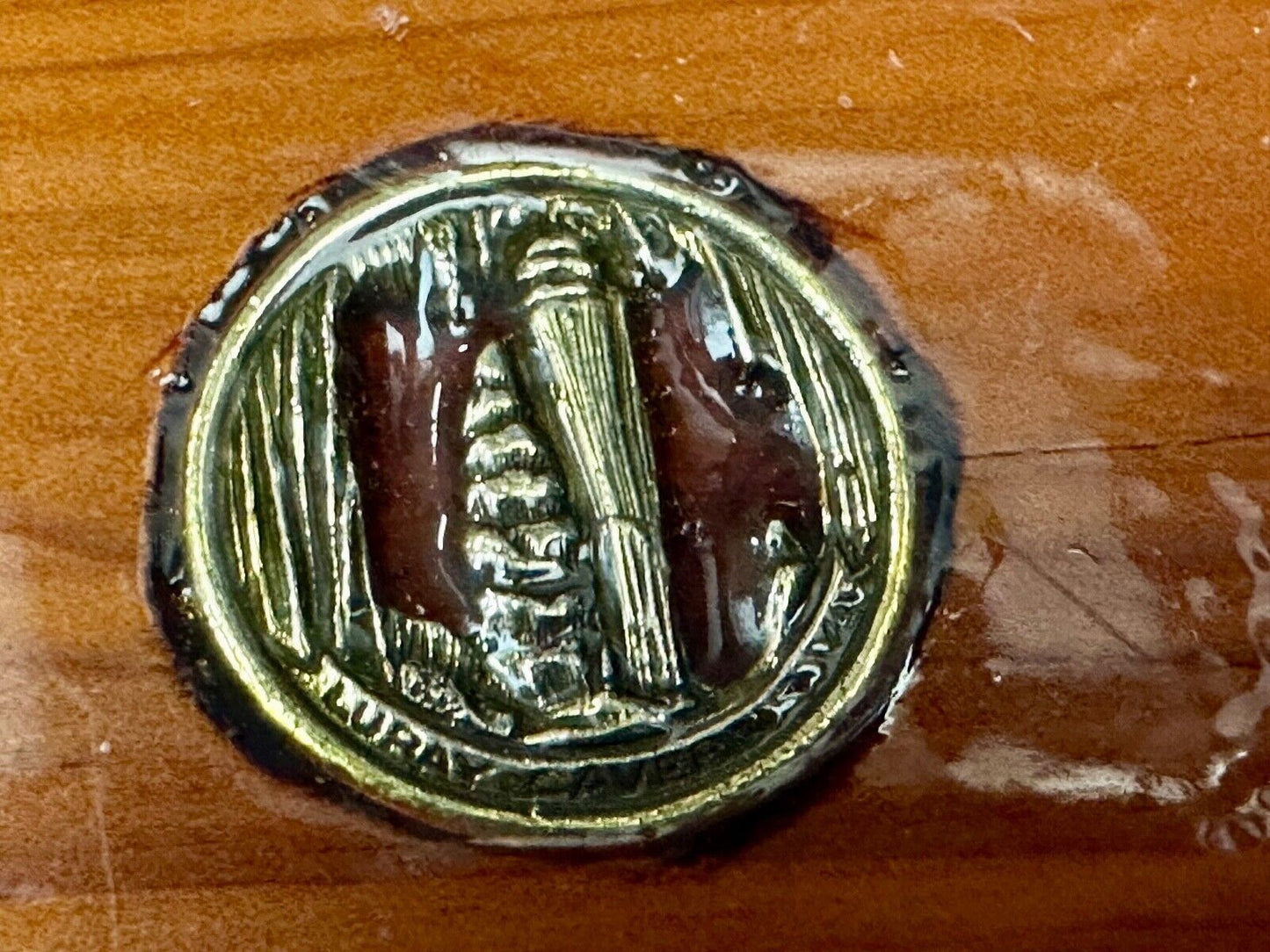 Artisan wood belt buckle with inlaid Luary Caverns cave token coin