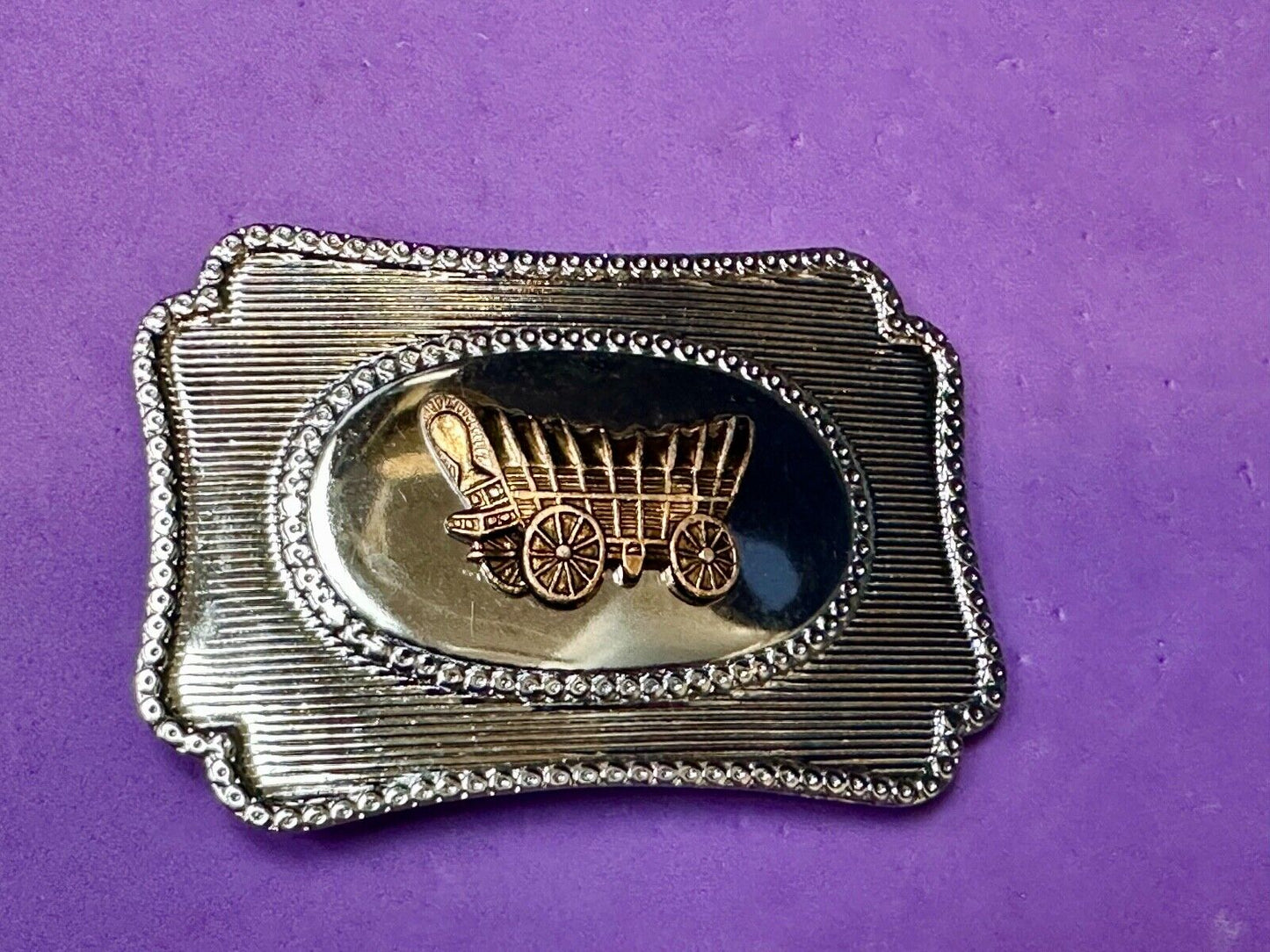 Vintage covered wagon western horse drawn transportation belt buckle