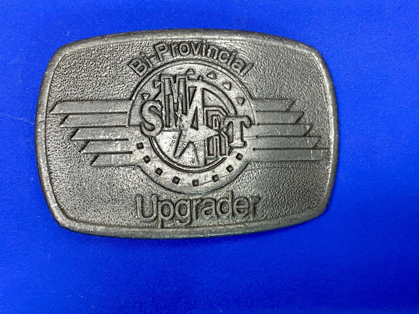 Bi-Provincial Smart Sm Art Upgrader Belt Buckle By Ad Ventures Studios
