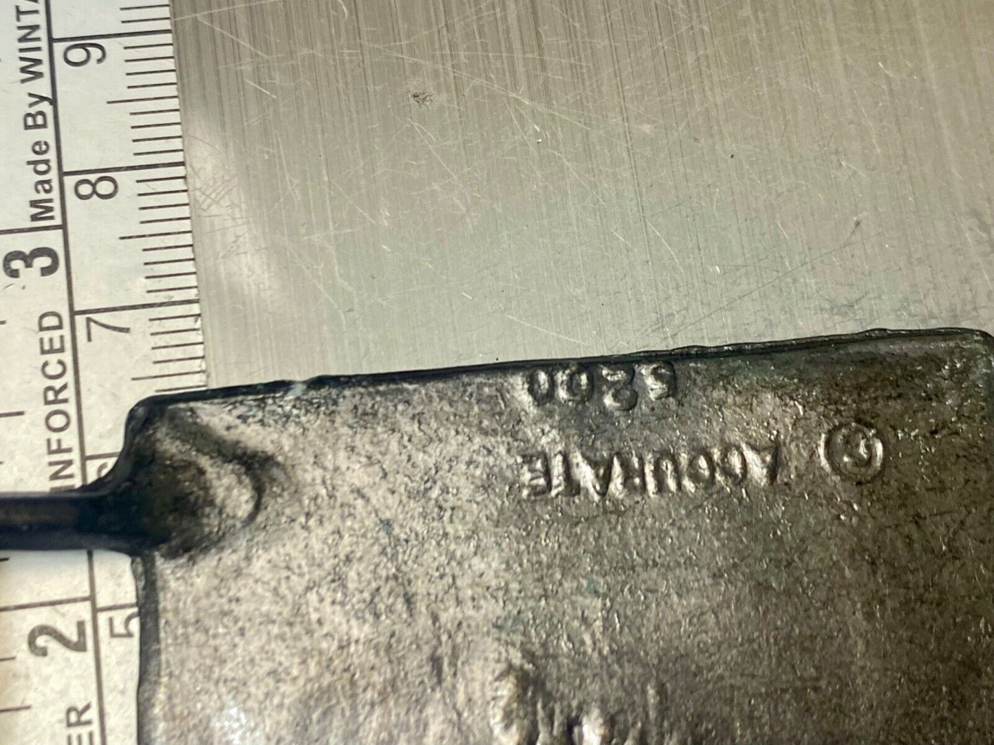 Two Tribal Warriors Indian figures? accoral marked numbered belt buckle