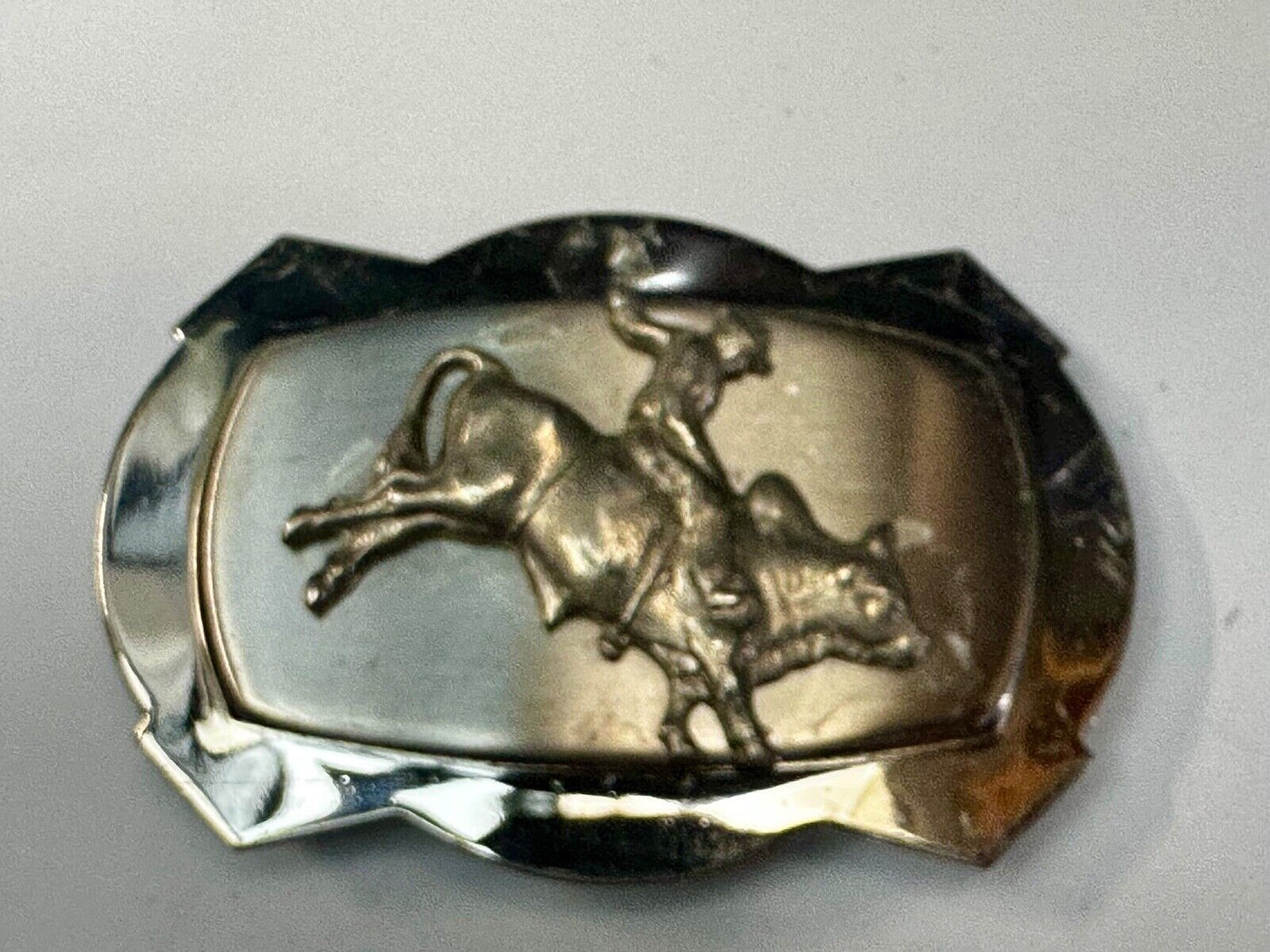 Vintage Cowboy Saddle Bronc on reflective two tone western belt buckle