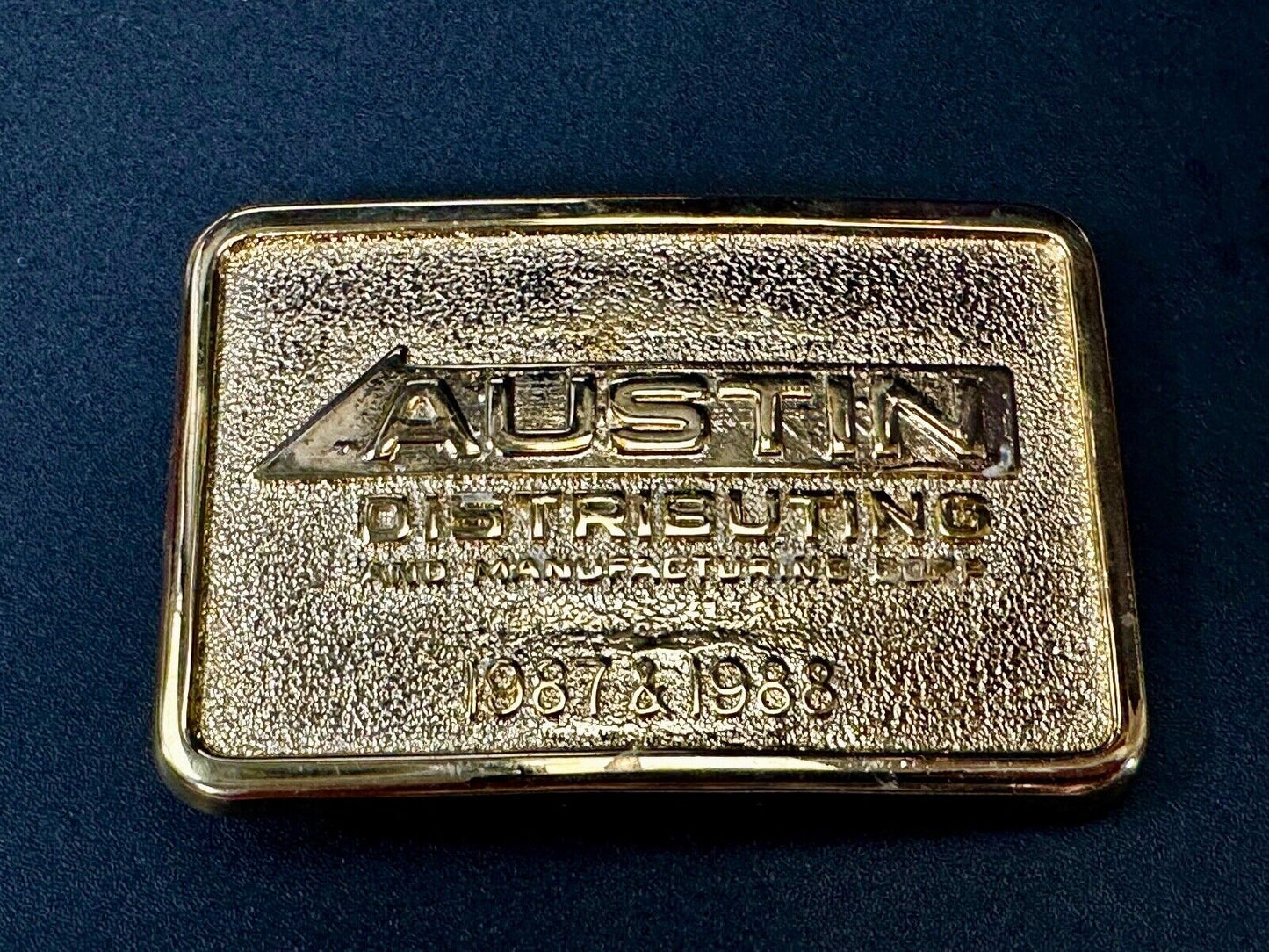 Austin Texas Distributing and Manufacturing 1987 Gold Tone Belt Buckle