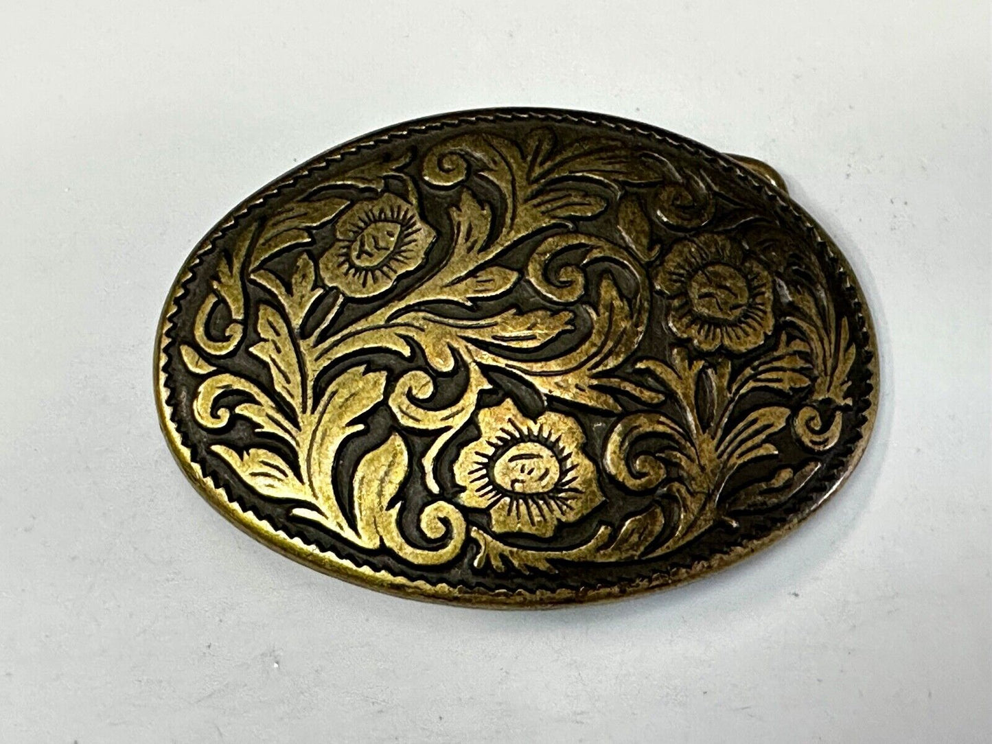 Vintage black and gold tone western flower floral theme cowboys belt buckle