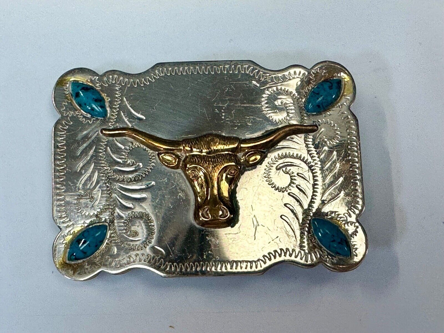 The Longhorn cow steer western nickel silver belt buckle with turquoise accents