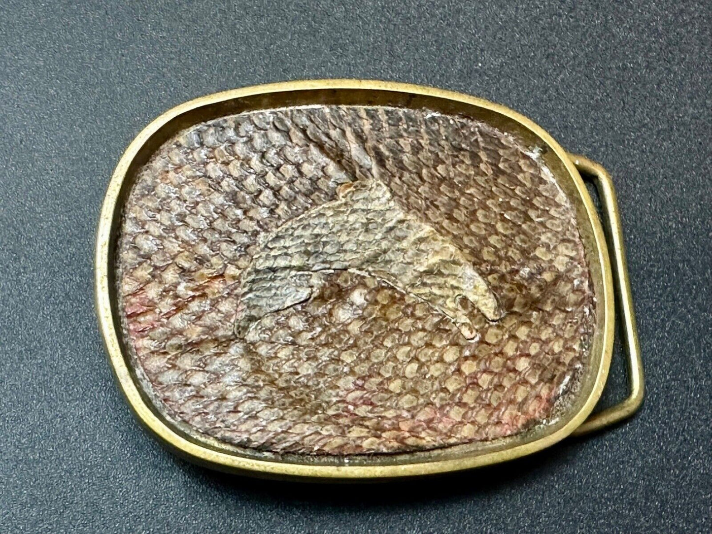 Artisan jumping fish on snake skin solid brass belt buckle