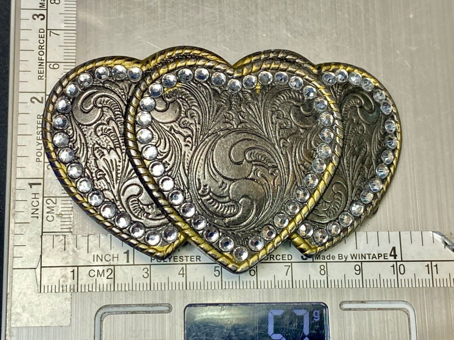 Three hearts ornate flower swirl belt buckle with thick rhinestone boarder