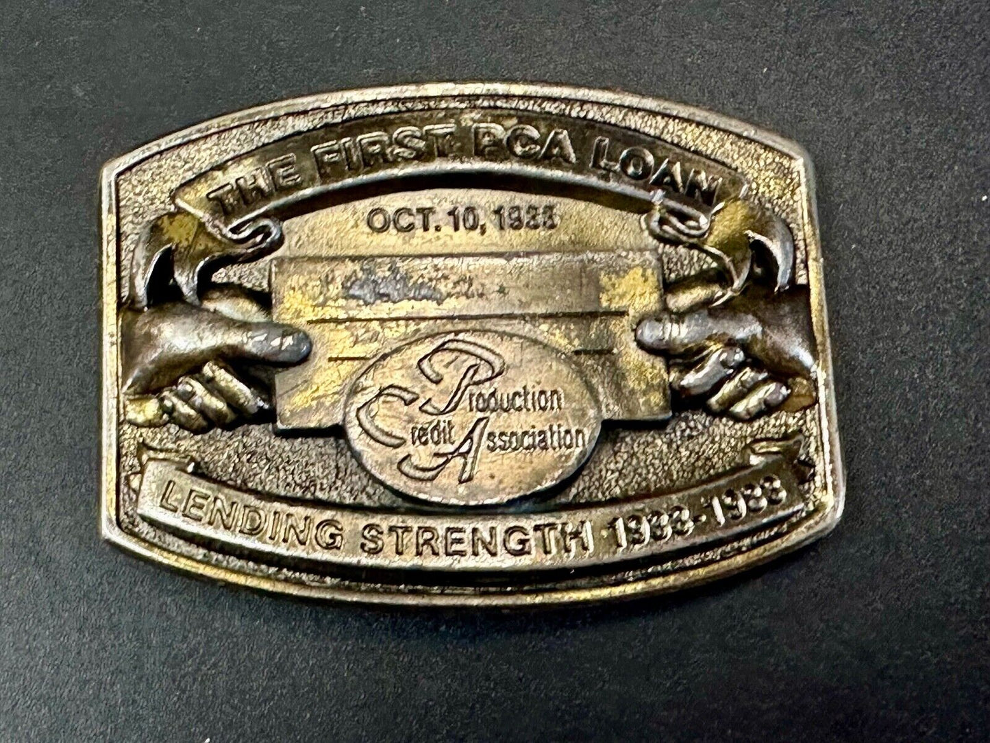 The First PCA loan Production Credit - Vintage The Great American Belt Buckle Co