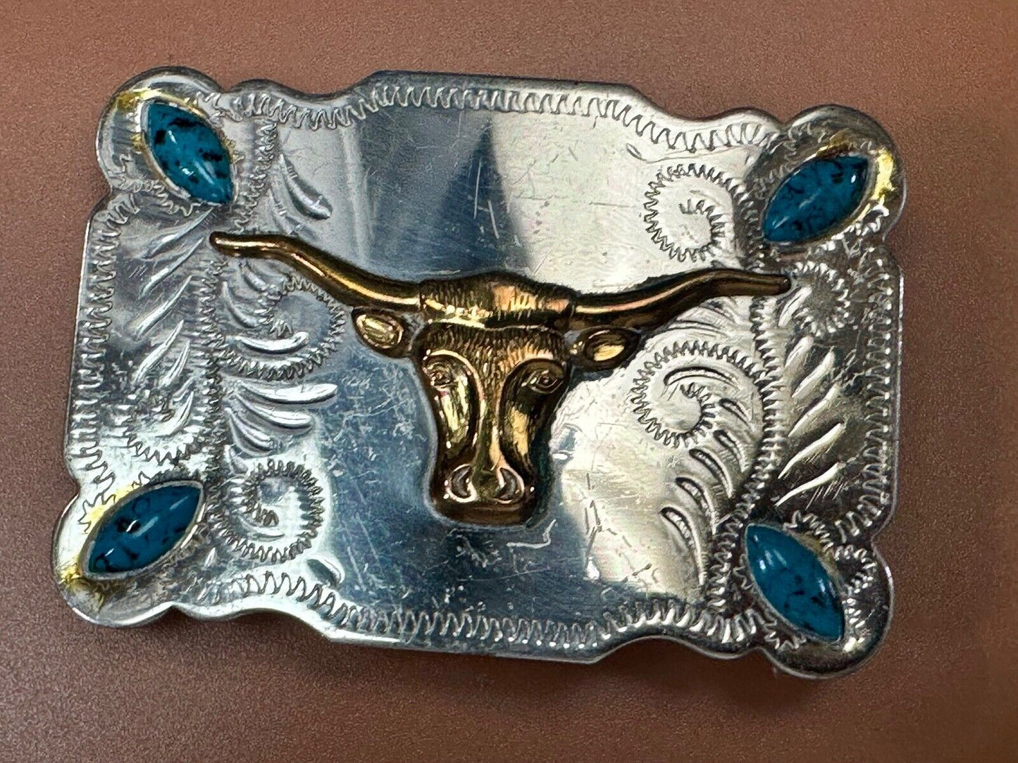 The Longhorn cow steer western nickel silver belt buckle with turquoise accents