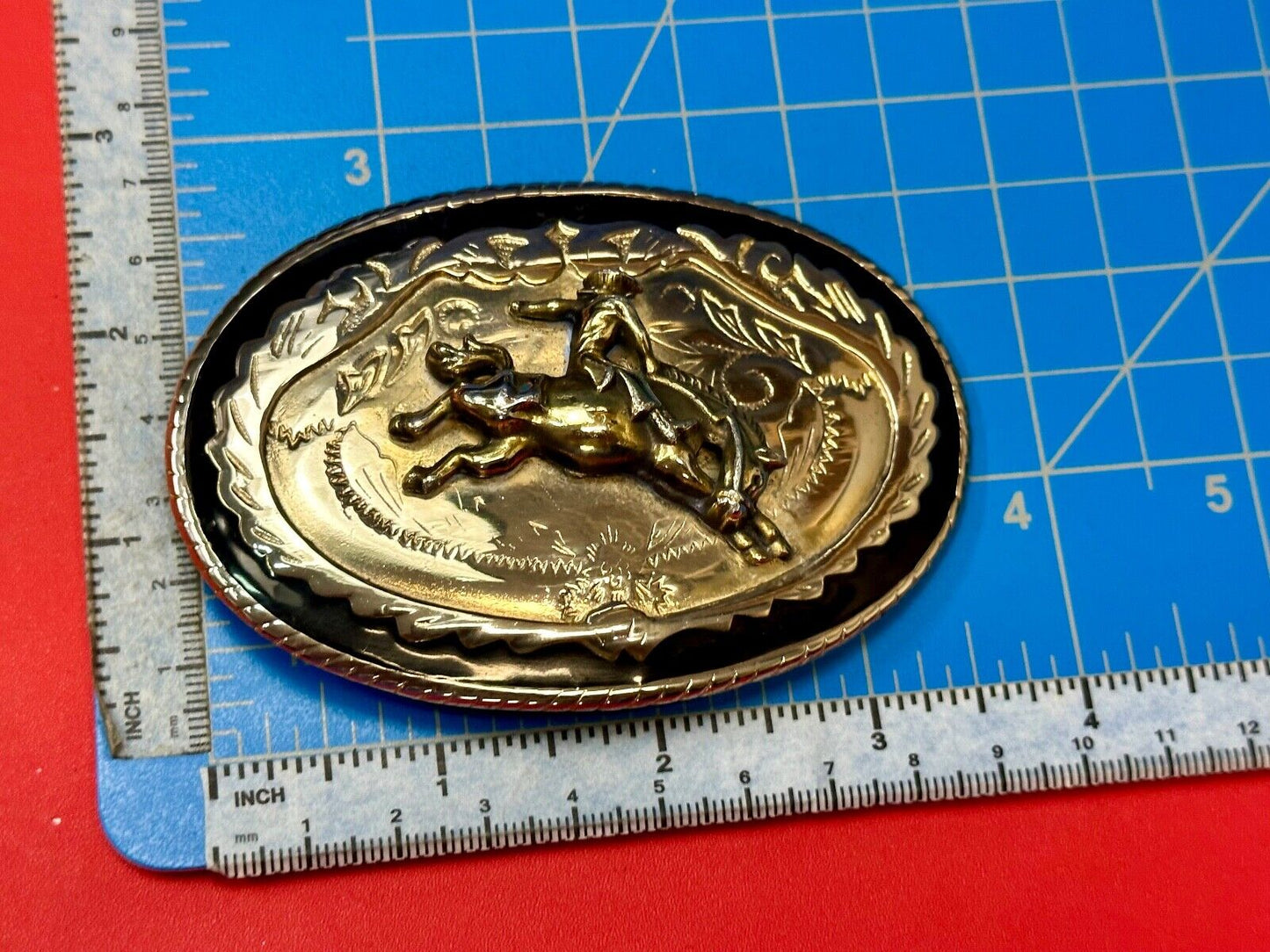 Beautiful Cowboy Saddle Bronc western black silver gold color belt buckle