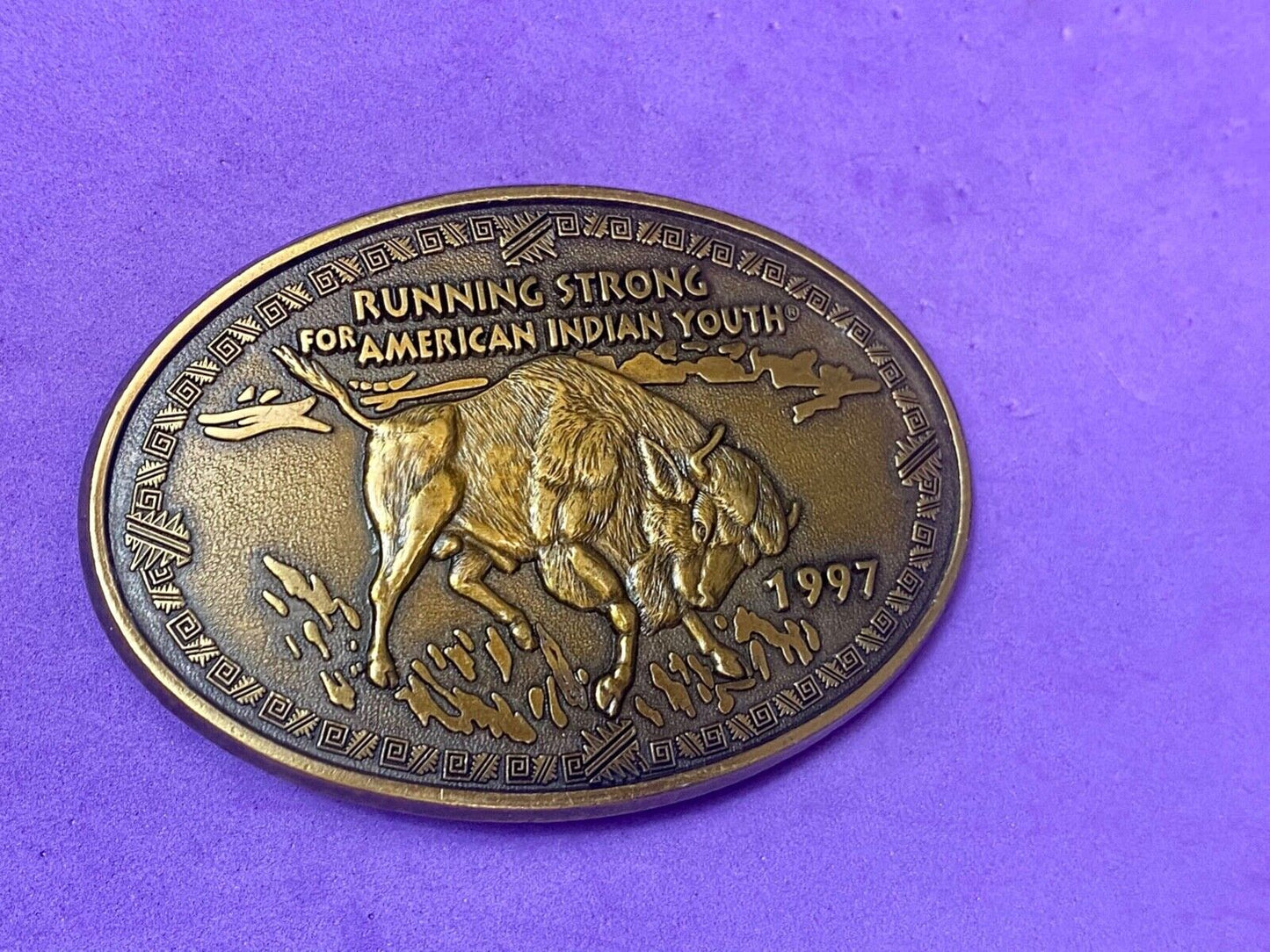 Vintage 1997 BUFFALO belt buckle RUNNING STRONG FOR AMERICAN INDIAN YOUTH