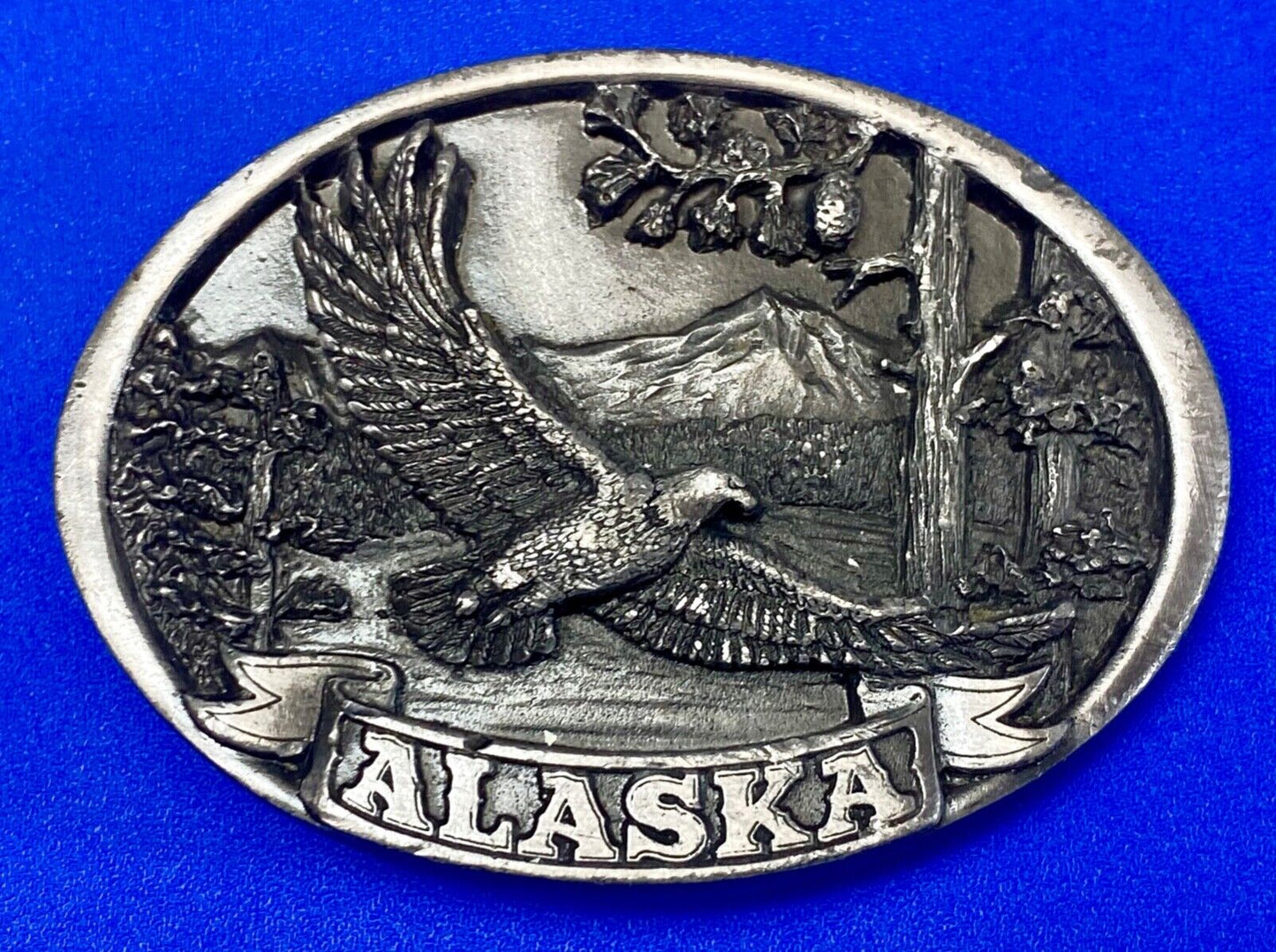 Vintage 1986 Eagle flying high over mountains Alaska belt buckle by C+-J