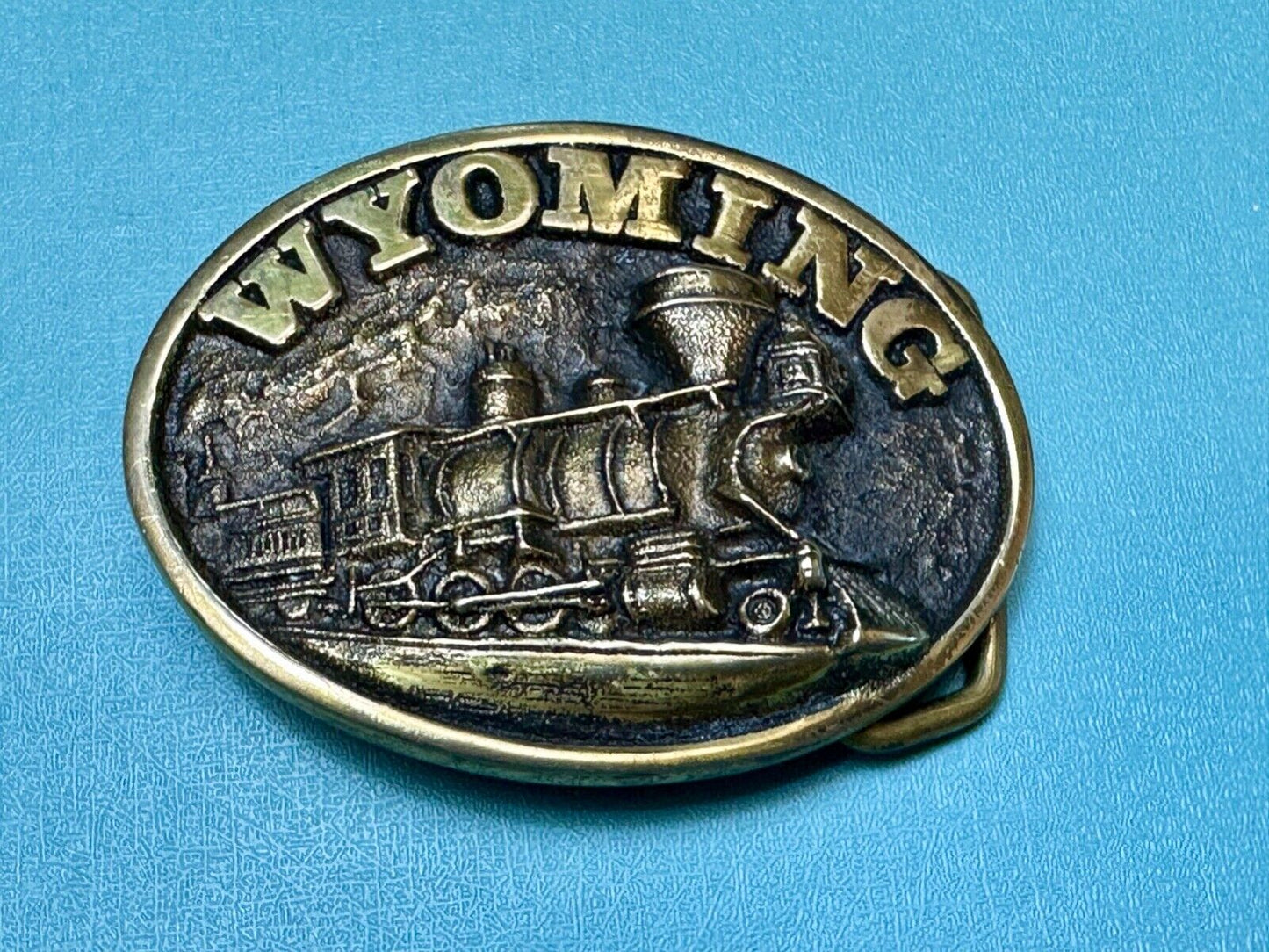 The great state of Wyoming Train History brass belt buckle by Heritage Mint LTD